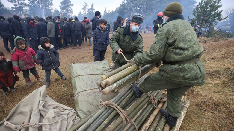 Belarusian servicemen set a tent for migrants gathering at the Belarus-Poland border near Grodno, Belarus. (Photo: Leonid Shcheglov/AP)
